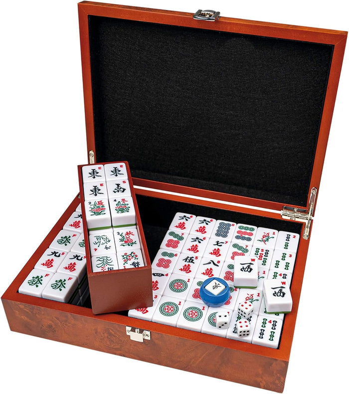 Open wood box with white Mahjong tiles featuring Arabic numerals, dice, and a wind indicator on a black felt interior.