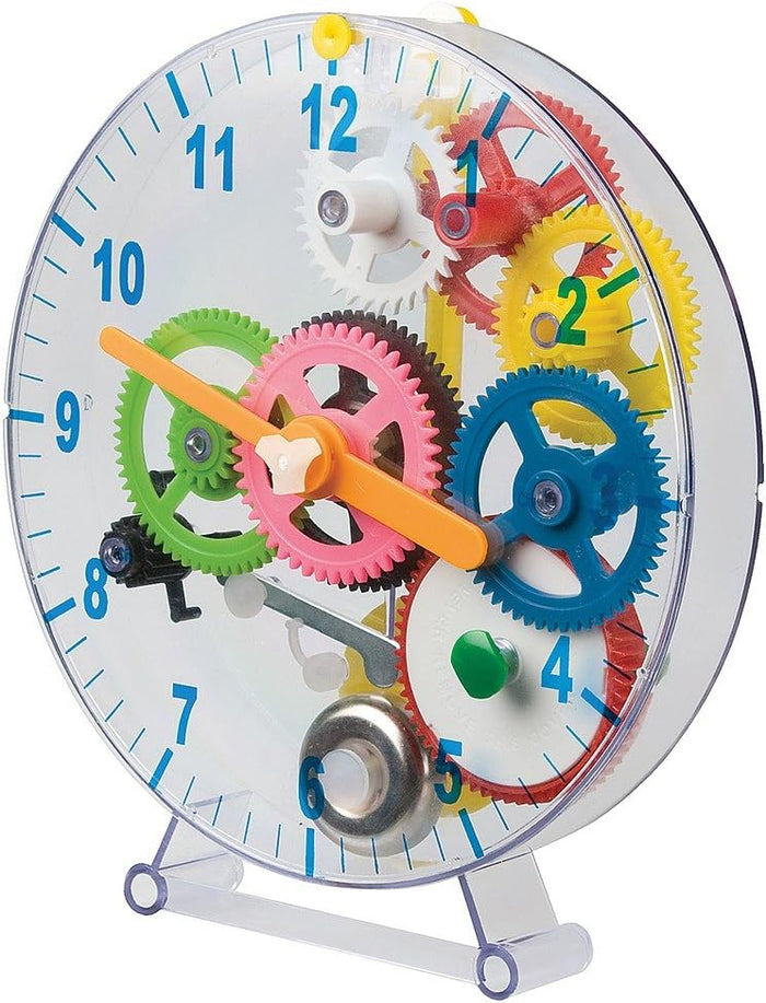 Transparent circular toy clock with colorful internal gears, orange hands, and large blue numbers on the face.