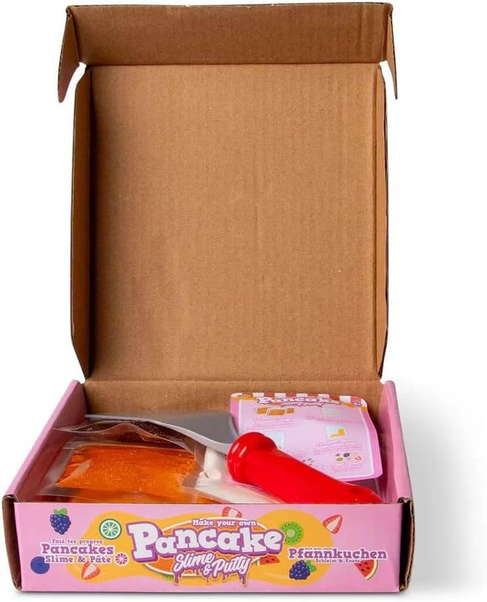 Open pink box with orange and brown slime packets, a red spatula, and instructions for pancake slime and putty.