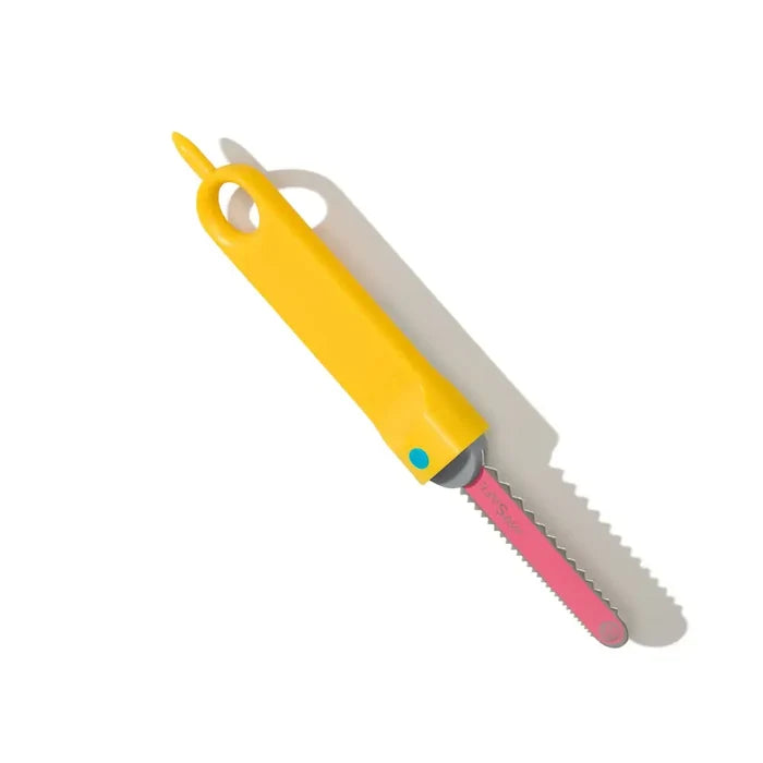 Yellow handheld tool with a large hanging hole and a short, pink serrated safety blade for cutting cardboard.