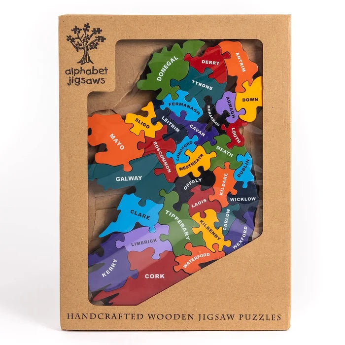Colorful wooden Ireland map jigsaw puzzle with labeled county pieces in a brown cardboard windowed box.