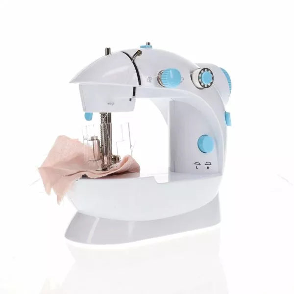 Compact white toy sewing machine with blue accents and a piece of pink fabric under the needle.