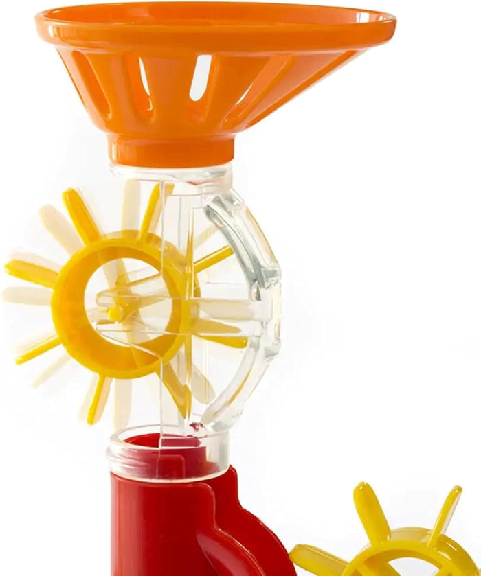 Orange funnel above a yellow spinning paddle wheel in clear plastic housing on a red base.