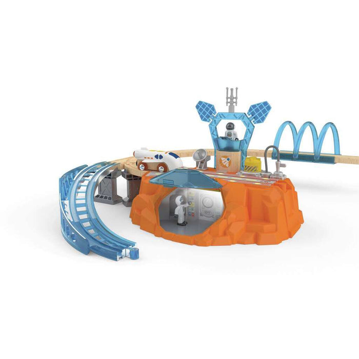 Orange rocky toy base with blue tracks, white shuttle, control tower, and astronaut figures in a Mars space scene.