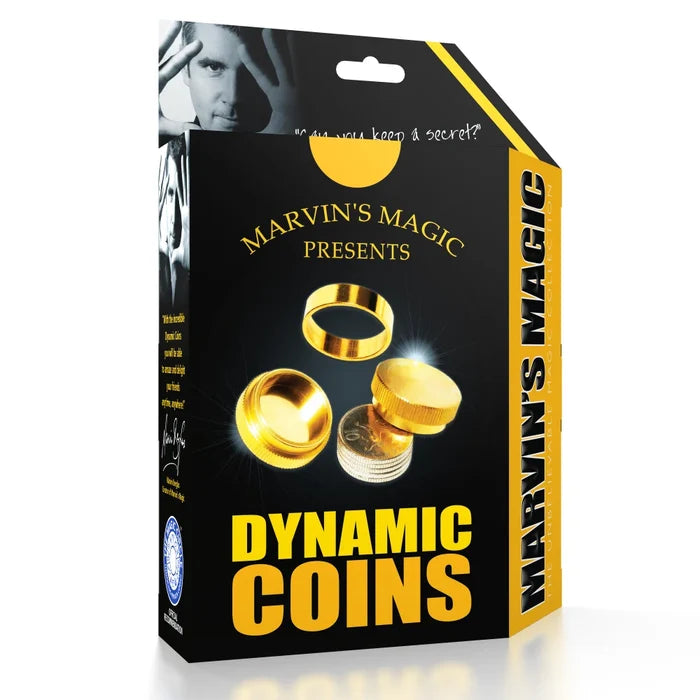Black and yellow magic trick box featuring images of gold metal caps and a stack of silver coins.