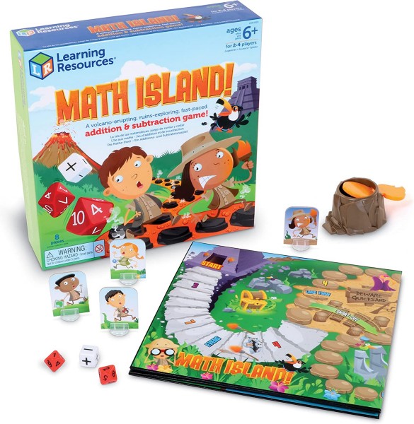 Math Island game box and pieces: colorful jungle map board, red and white dice, standees, and a plastic volcano launcher.
