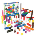 Colorful interlocking cubes stacked and built into a helicopter, next to an activity guide and original box.