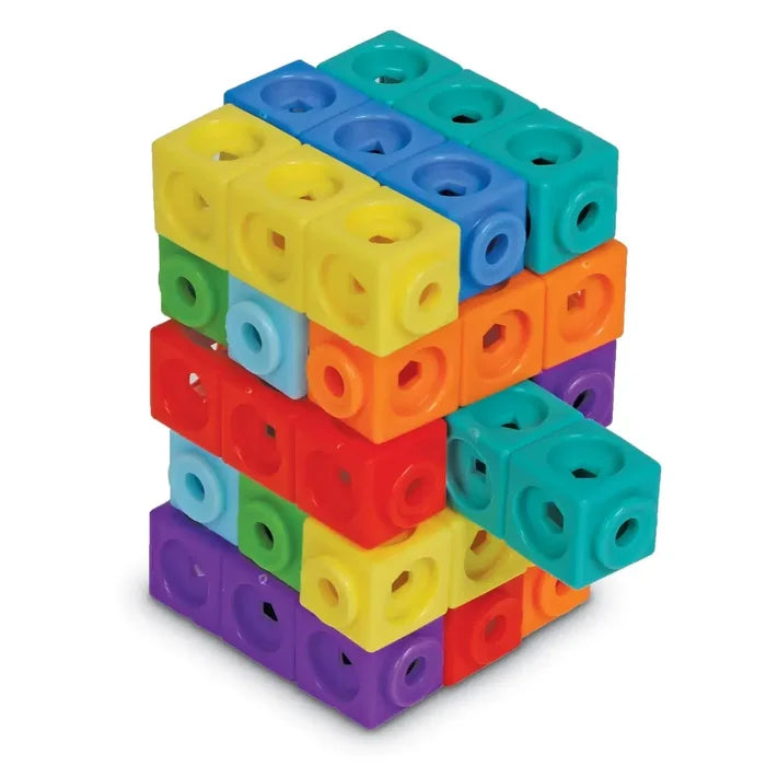 Colorful interlocking cubes in a 3D puzzle stack with circle, square, and triangle cutouts on each face.