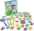 Educational math game with bug-shaped cards, a circular spinner, and four colorful plastic fly swatters.