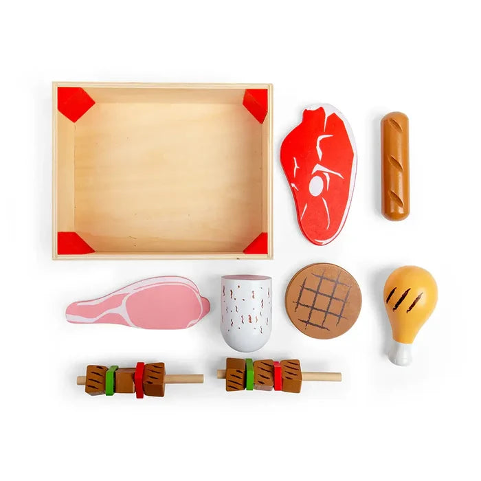 Wooden toy meat set with a steak, burger, drumstick, and kebabs in a light wood crate with red corners.