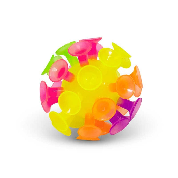 Round toy with protruding neon pink, yellow, green, and purple suction cups on a plain white background.