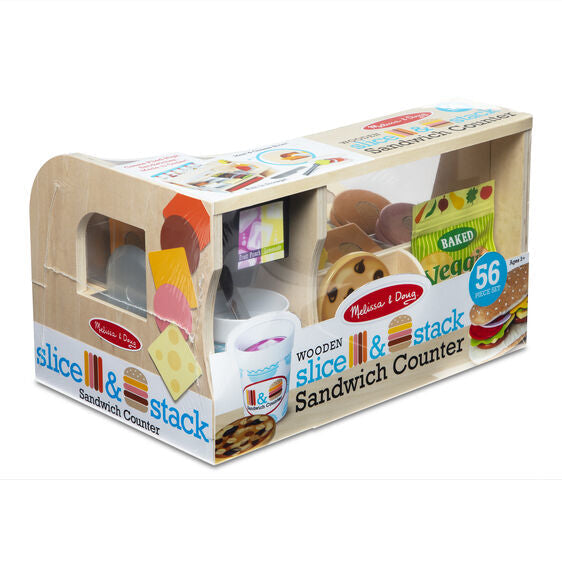 56-piece wooden sandwich counter toy in its box with colorful play food slices, a bag of chips, and a drink cup.