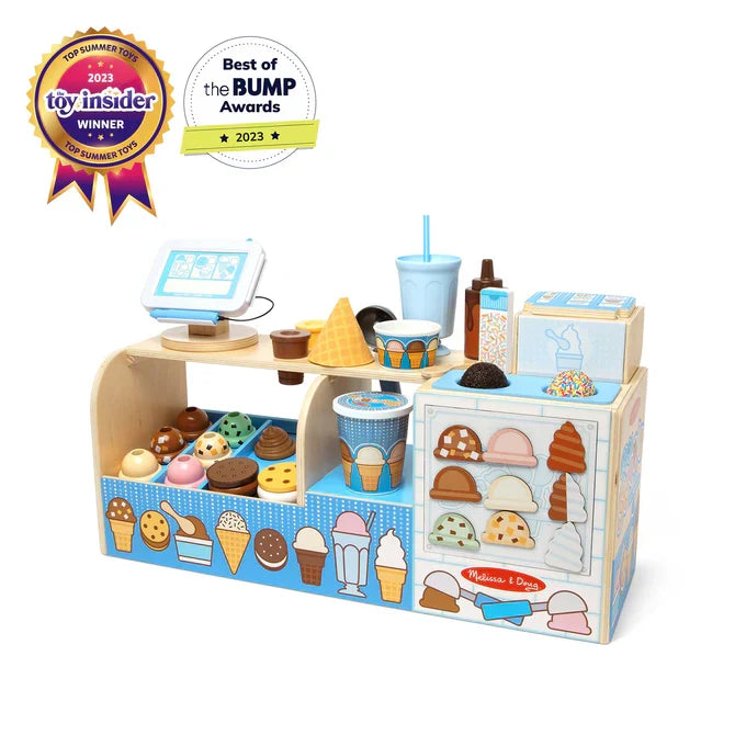 Wooden toy ice cream shop with colorful scoops, cones, and a tablet register in light blue and natural wood.