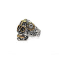 Men's stainless steel rings featuring a two-tone skull and cross design by Glitters, showcasing bold, detailed craftsmanship.