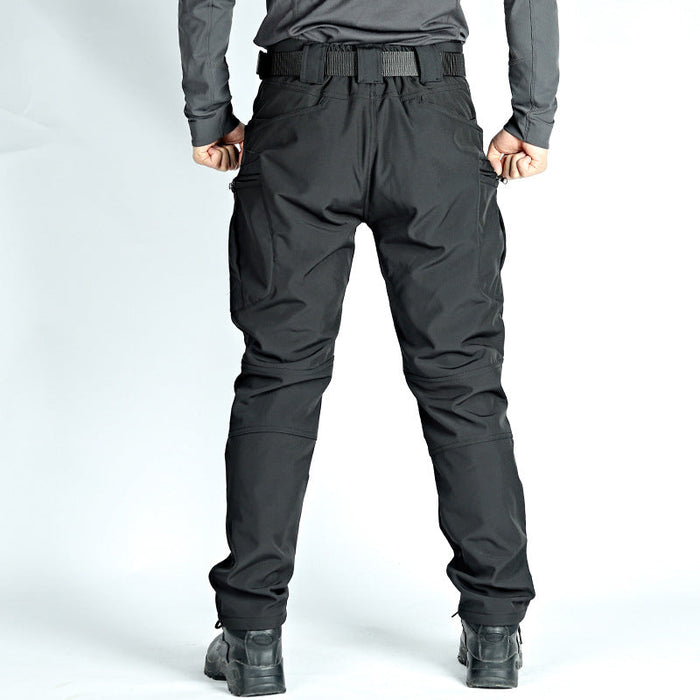 Men's black tactical cargo pants with water-resistant soft shell fabric and fleece lining, ideal for outdoor and tactical activities.