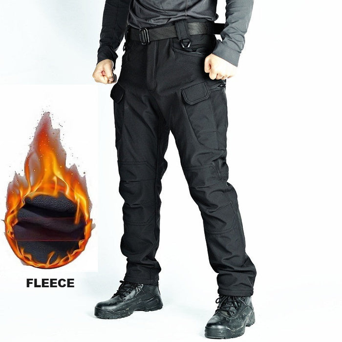 Men's black tactical cargo pants with water-resistant soft shell fabric and fleece lining, ideal for outdoor and tactical wear.