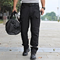 Men's black tactical cargo pants with water-resistant flex ripstop fabric, featuring multiple pockets and durable design.