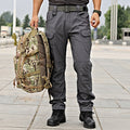 Men's tactical cargo pants from dealonline.co.nz, water-resistant flex ripstop fabric with multiple pockets and durable design.