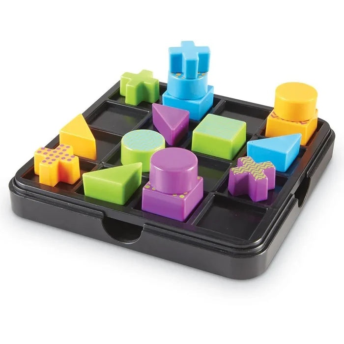 Colorful 3D geometric blocks like cubes and crosses on a black square 4x4 grid game board.