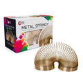 Bronze-colored metal springy toy arched next to its white packaging box featuring vibrant, colorful paint splashes.
