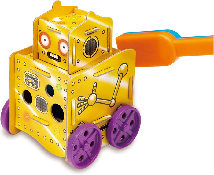 Bright yellow blocky robot toy with purple wheels being moved by an orange and blue magnetic wand.