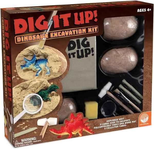Orange dinosaur dig kit box featuring three large eggs, tools, and toy figures being unearthed from plaster.