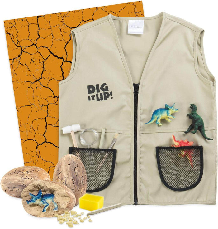 Tan child's explorer vest with digging tools, dinosaur eggs, and figurines on a cracked orange background.