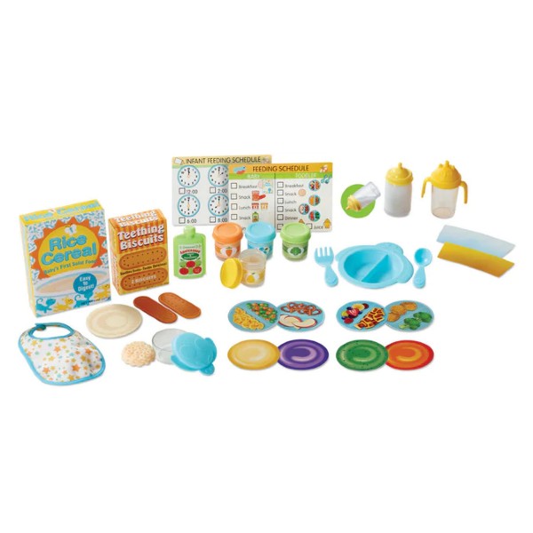 Toy baby feeding set featuring cereal boxes, bottles, a bib, blue dishes, and illustrated meal schedule cards.