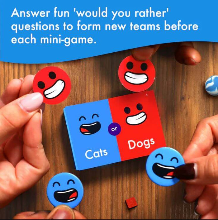 Hands holding red and blue smiley face tokens over a Cats or Dogs choice card to form teams for mini-games.
