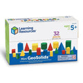 A white box of 32 colorful red, yellow, green, and blue plastic 3D geometric shapes for ages 5 and up.
