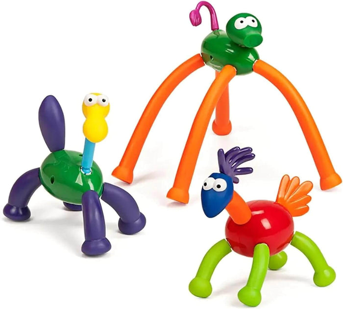 Three colorful toy creatures built from interchangeable plastic parts in vibrant green, orange, red, and purple.