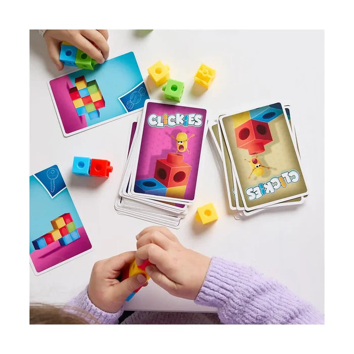 Hands assembling colorful cube blocks alongside illustrated pattern cards from the Clickies building game.