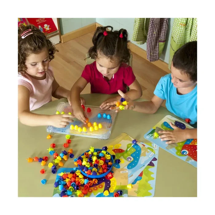 Three children play with bright, mushroom-shaped plastic pegs on clear pegboards and colorful activity sheets.