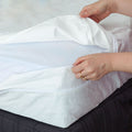 Open MiteGuard cotton mattress cover showing soft, breathable fabric designed to protect against mites and allergens.