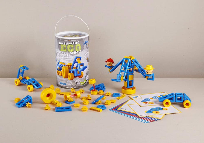 Blue and yellow plastic building pieces, wheels, and figurines shown with a storage tub and design instruction cards.