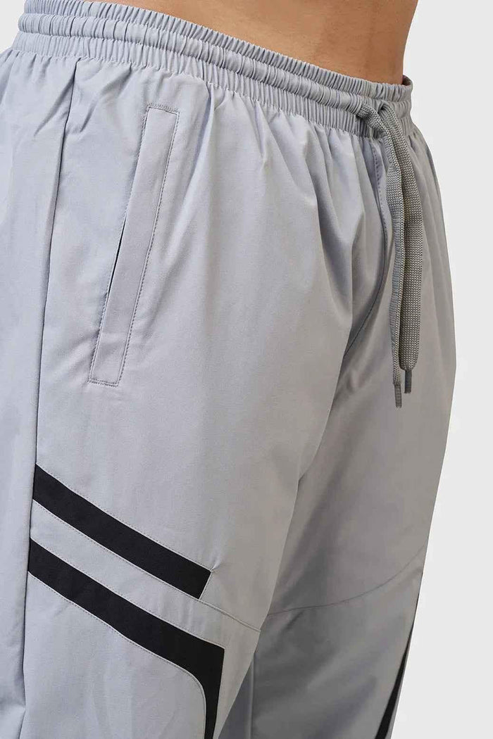 Light grey Fuaark Nz Momentum Joggers, comfortable athletic pants with a relaxed fit and drawstring waistband.