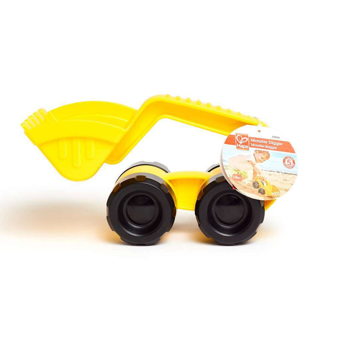 Bright yellow toy digger with massive textured black wheels and a large front shovel, including a Hape brand tag.