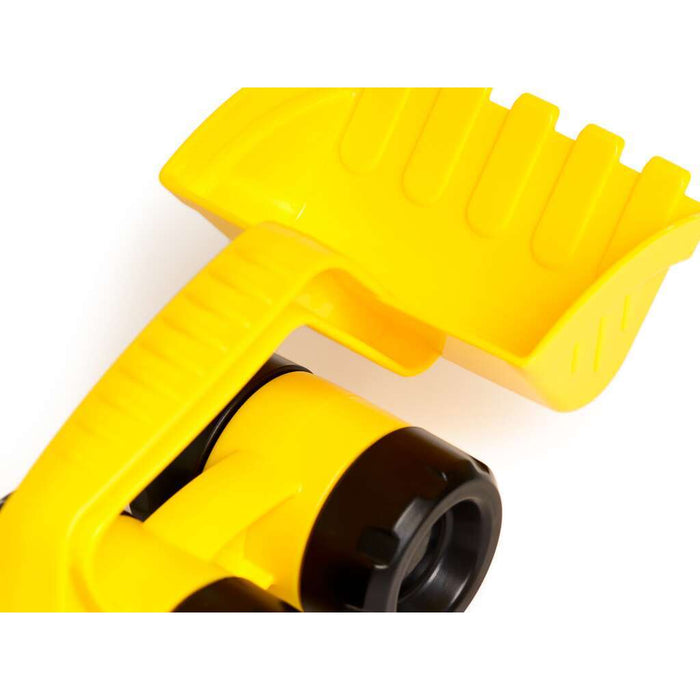 Close-up of a bright yellow plastic toy digger bucket with a black textured wheel and sturdy handle.