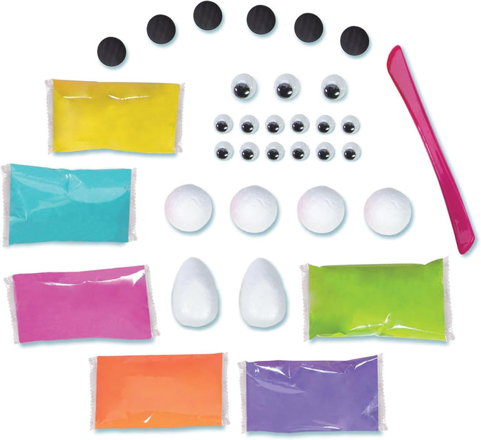 Craft kit with 6 colorful clay packs, googly eyes, white foam shapes, 6 black round magnets, and a pink modeling tool.