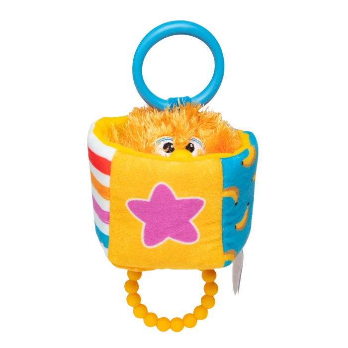 Colorful soft cube with a fuzzy orange monster inside, blue plastic hanging ring, and yellow beaded teething ring.