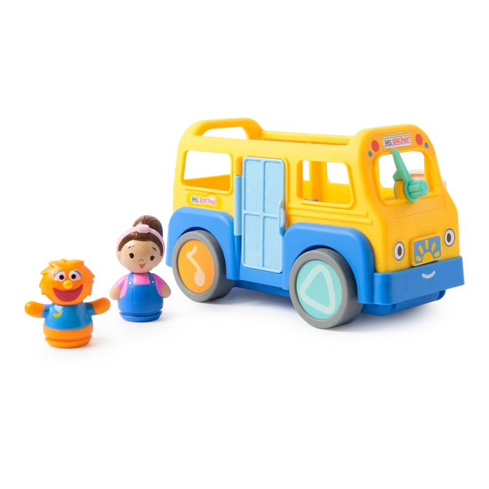 Yellow and blue toy school bus with a girl figurine and an orange monster toy on a white background.