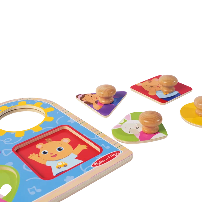 Colorful wooden peg puzzle with large knobs and pieces in triangle, square, heart, and circle shapes with cartoon art.
