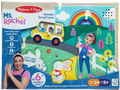Colorful wooden puzzle with knob pieces of a bus, girl, and bunny. Packaging features a photo of Ms. Rachel.