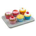 Six colorful wooden toy cupcakes with varied icing designs and toppings in a gray wooden muffin tray.