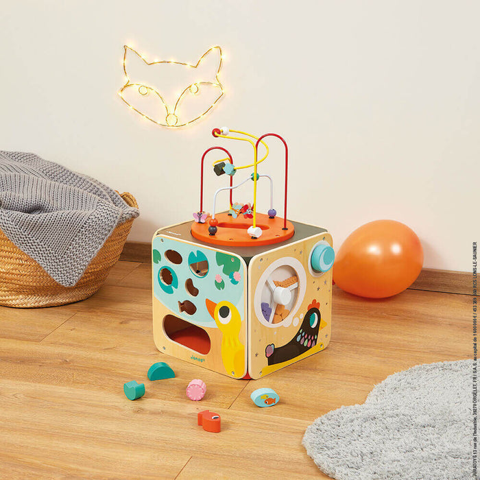 Bright wooden activity cube with a wire bead maze top and shape sorting sides featuring animal illustrations.
