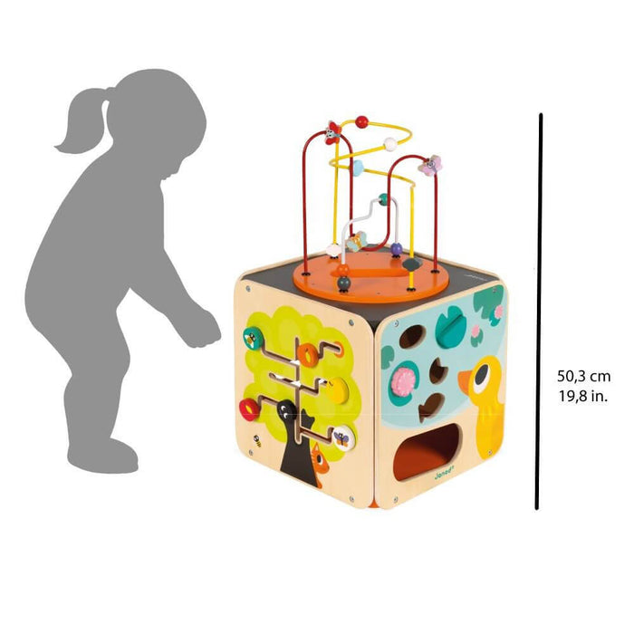 Colorful wooden activity cube with bead maze, animal sliders and shape sorter, shown with toddler silhouette for scale.