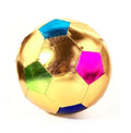 Shiny gold metallic fabric soccer ball with colorful blue, pink, and green pentagonal patches.