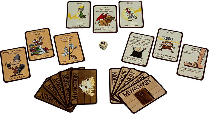 Tan Munchkin cards with cartoon art scattered near fanned-out brown cards and a white six-sided die.