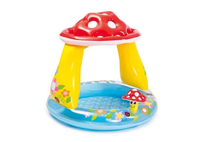 Inflatable blue baby pool with yellow pillars and a red mushroom-shaped canopy decorated with flowers and ladybugs.
