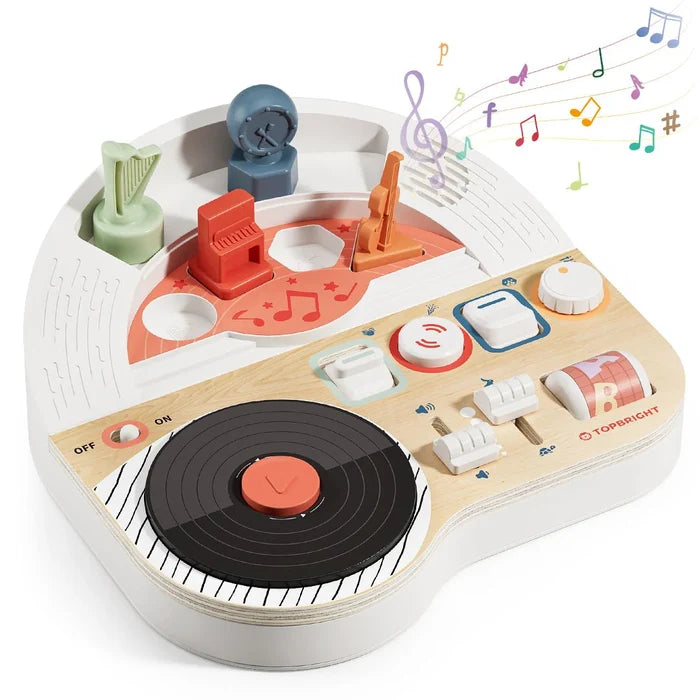 Musical toy station with a black record player, colorful instrument shapes, and buttons on a white and wood base.